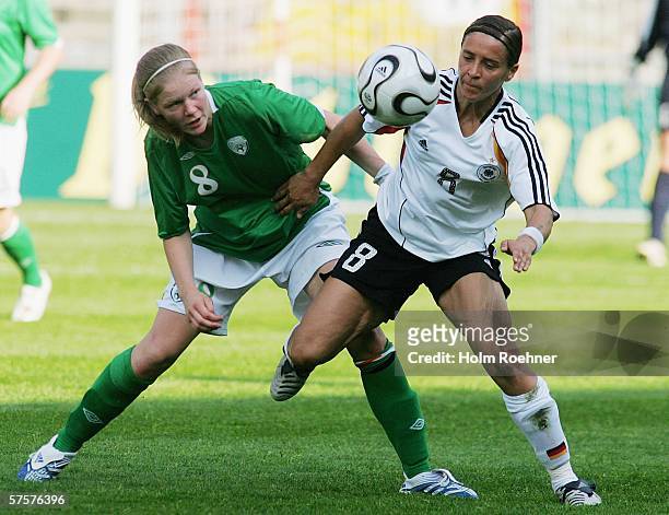 Diane Caldwell of Ireland and Sandra Smisek of Germany chase the ball during the Women's FIFA World Cup China 2007 Qualifying match between Germany...