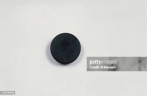 Overhead view of an ice hockey puck in a studio, 1990s.