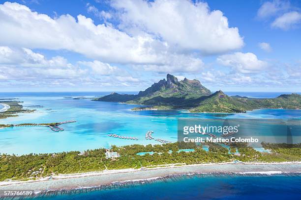 aerial view of bora bora island, french polynesia - bora bora atoll stock-fotos und bilder