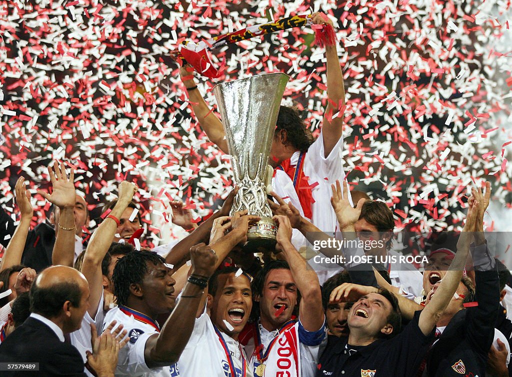 Sevilla players jubilates with their tro