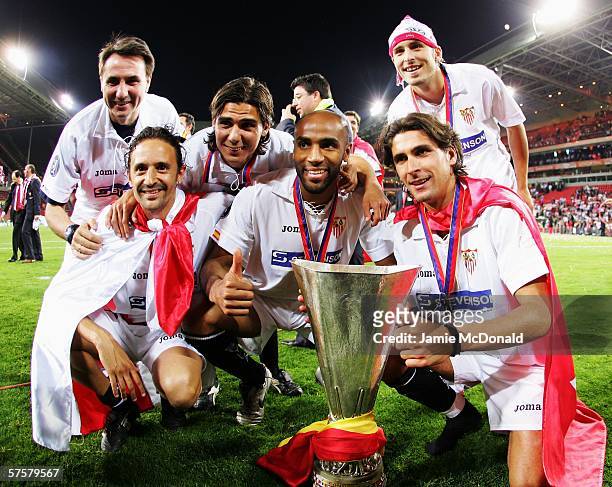 Frederic Kanoute of Sevilla FC poses with his teammate after they won the UEFA Cup final against Middlesbrough FC on May 10, 2006 at the PSV Stadion...