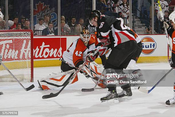 Goaltender Robert Esche of the Philadelphia Flyers looks to make a save on Thomas Vanek of the Buffalo Sabres in game five of the Eastern Conference...