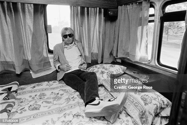 Rock singer Tom Petty relaxes in his tour bus between 1981 concert performances in Chicago, Illinois.