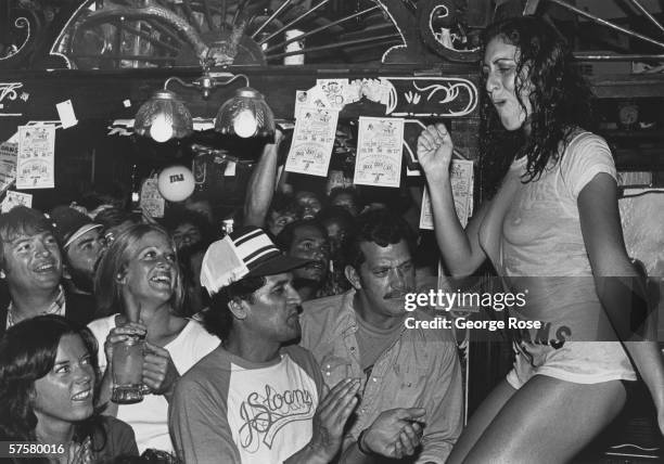 Women compete in a 1979 wet t-shirt contest at nightclub J Sloans in West Hollywood, California.