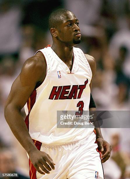 Dwyane Wade of the Miami Heat looks toward the bench after extending a commanding lead with a basket in the first quarter against the New Jersey Nets...