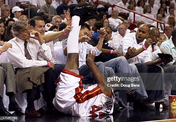 James Posey of the Miami Heat slides into the courtside seats after saving a ball in the second quarter of game two of the Eastern Conference...