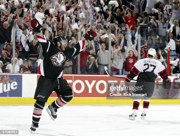 Dumont of the Buffalo Sabres celebrates scoring the game-winning goal at 14:55 of the first overtime period to defeat the Ottawa Senators 3-2 in game...