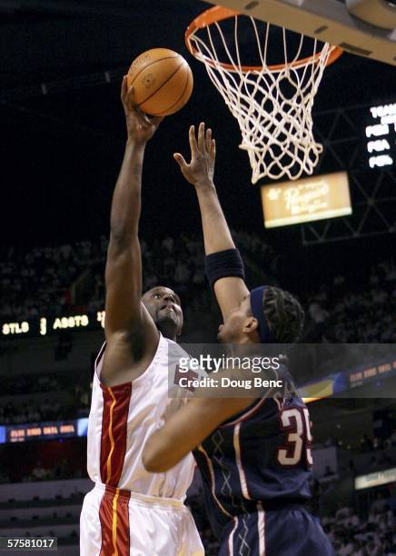 Shaquille O'Neal of the Miami Heat shoots over Jason Collins of the New Jersey Nets in game two of the Eastern Conference Semifinals during the 2006...