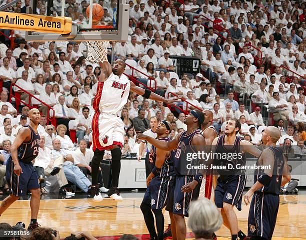 Dwyane Wade of the Miami Heat dunks against the New Jersey Nets in game two of the Eastern Conference Semifinals during the 2006 NBA Playoffs at the...