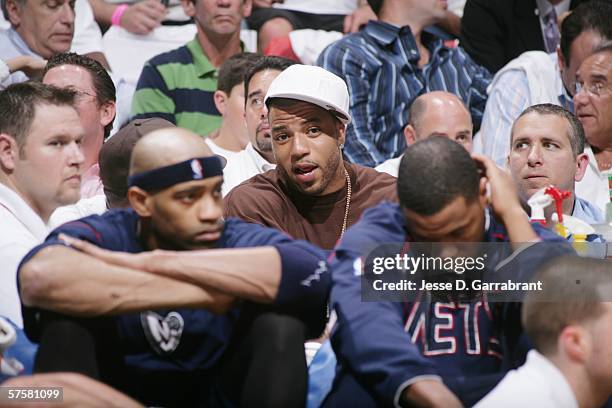 Kenyon Martin of the Denver Nuggets watches the play of the New Jersey Nets against the Miami Heat in game two of the Eastern Conference Semifinals...