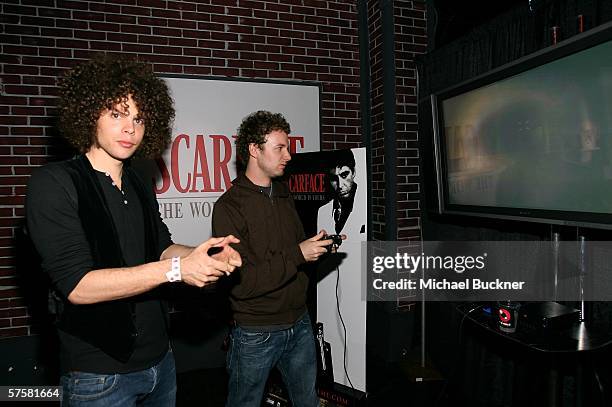 Chris Ross and Myles Heskett of Wolfmother play Scarface: The World Is Yours Video Game at its launch at The Vangaurd on May 10, 2006 in Los Angeles,...