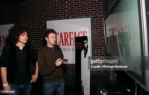 Chris Ross and Myles Heskett of Wolfmother play Scarface: The World Is Yours Video Game at its launch at The Vangaurd on May 10, 2006 in Los Angeles,...