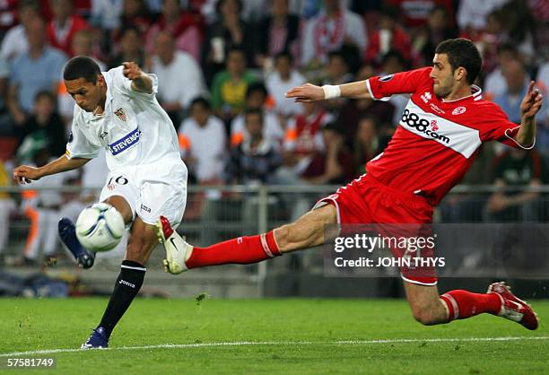 Eindhoven, NETHERLANDS: Sevilla's Spanish forward Jesus Navas Adriano Correia vies with Middlesbrough 's British defender Stuart Parnaby during the...