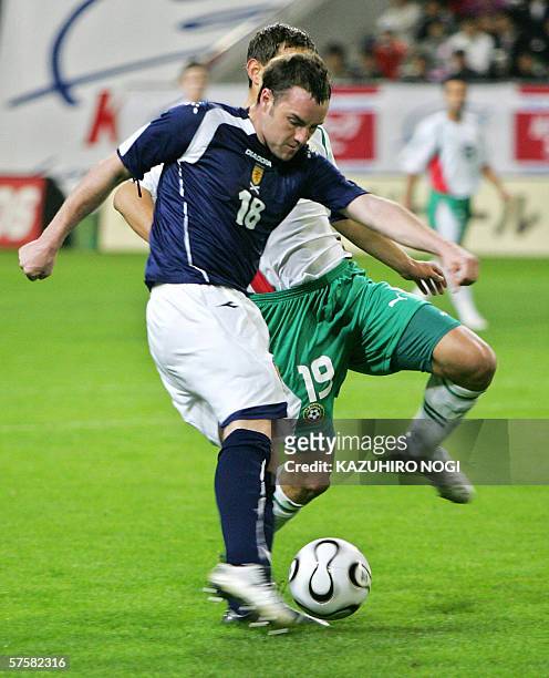 Scotland's forward Kris Boyd shoots the ball in the first half of the Kirin Cup football match against Bulgaria at the Kobe Wing Stadium, 11 May...