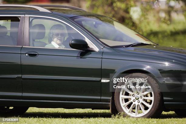 Queen Elizabeth II watches the Land Rover International Driving Grand Prix from her new Jaguar X Type estate car on the first day of the Royal...