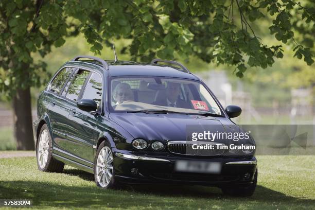 Queen Elizabeth II watches the Land Rover International Driving Grand Prix from her new Jaguar X Type estate car on the first day of the Royal...