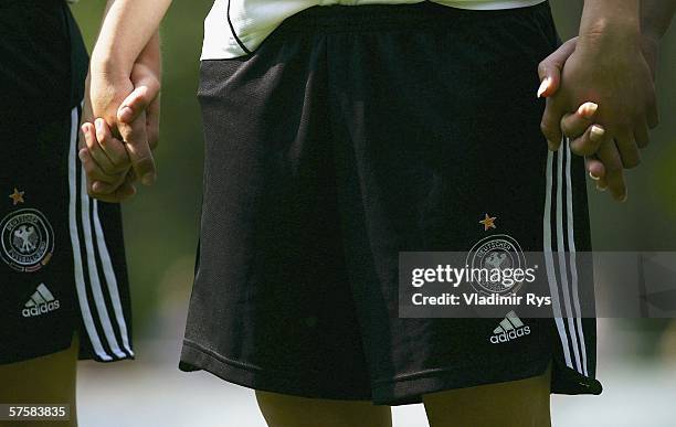 Players of the German team hold hands prior to the friendly match between the Women German Under 21 team and the USA Under 20 team at the Hans...
