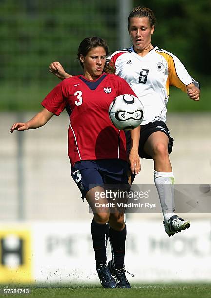 Lena Goessling of Germany and Tina DiMartino of the USA battle for the ball during the friendly match between the Women's German Under 21 team and...