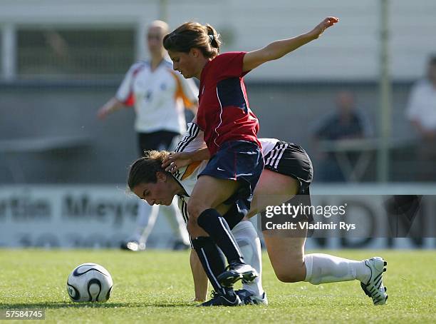 Aferdita Kameraj of Germany and Tina DiMartino of the USA battle for the ball during the friendly match between the Women's German Under 21 team and...