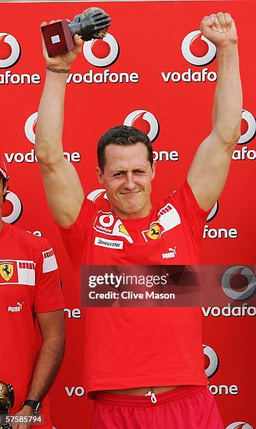 Michael Schumacher of Germany and Ferrari plays beach soccer during the previews to the Spanish Formula One Grand Prix at the Circuit De Catalunya on...