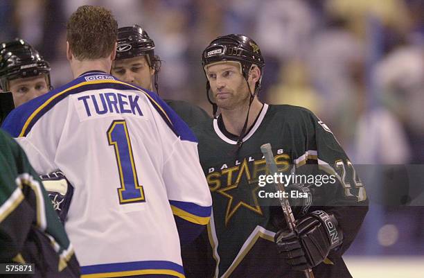 Kirk Muller of the Dallas Stars congratulates goalie roman Turek of the St. Louis Blues after Game 4 of the Western Conference Semifinals at the...