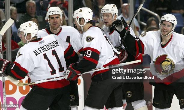 Daniel Alfredsson, Wade Redden, Jason Spezza, Dany Heatley, and Patrick Eaves of the Ottawa Senators celebrate a goal by Redden in the third period...