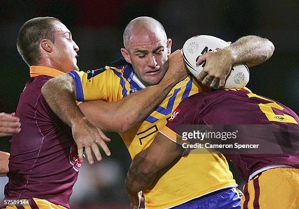 Matt Geyer of City is tackled during the NRL City v Country Origin match at Apex Oval May 12, 2006 in Dubbo, Australia.