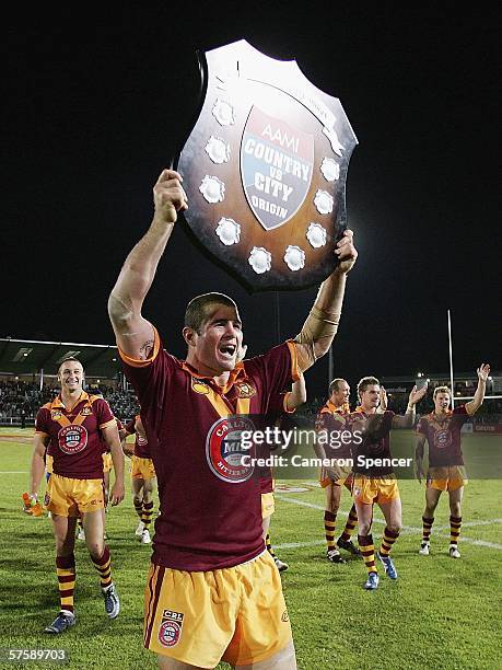 Country captain Andrew Ryan celebrates with the trophy after the Country team's victory in the NRL City v Country Origin match at Apex Oval May 12,...