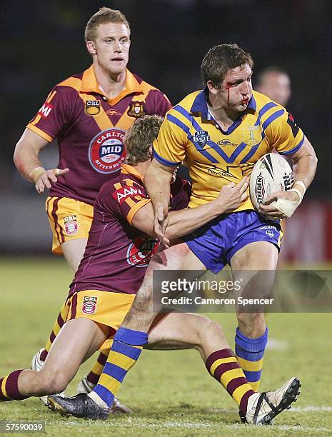 Ryan Hoffman of City is tackled during the NRL City v Country Origin match at Apex Oval May 12, 2006 in Dubbo, Australia.
