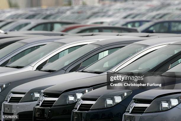 Rows of Vauxhall Astra cars are seen lined up at Vauxhall Motor Company's Astra production centre on May 12 Ellesmere Port, England. Workers at the...