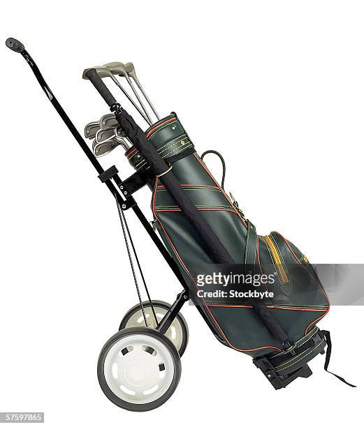 golf clubs in a golf bag on a trolley - golf bag stock pictures, royalty-free photos & images