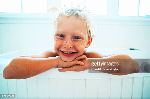 portrait of a young boy (8-10) in a tub - hands resting stock pictures, royalty-free photos & images