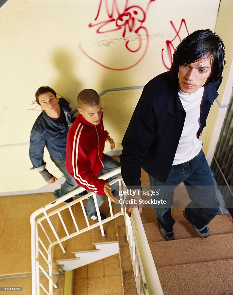 Steps Men Elevated View Of Three Young Men Walking Up Steps High-Res Stock Photo ...