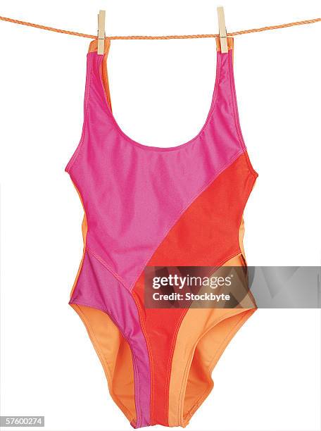woman's swimsuit hanging on clothes line - badeanzug stock-fotos und bilder