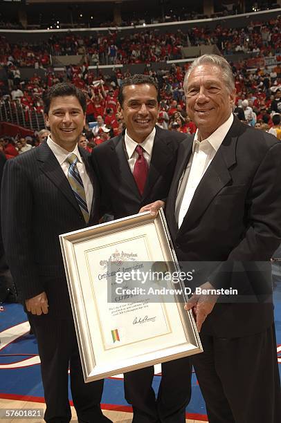 Donald Sterling, owner of the Los Angeles Clippers, accepts a certificate from Los Angeles Mayor Antonio Villaraigosa during a break in a play...