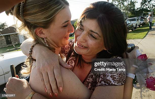 Cabrini High School junior Danielle DiMaggio is hugged by her displaced mother Anna who travelled three hours from Lafayette, Louisiana to see...