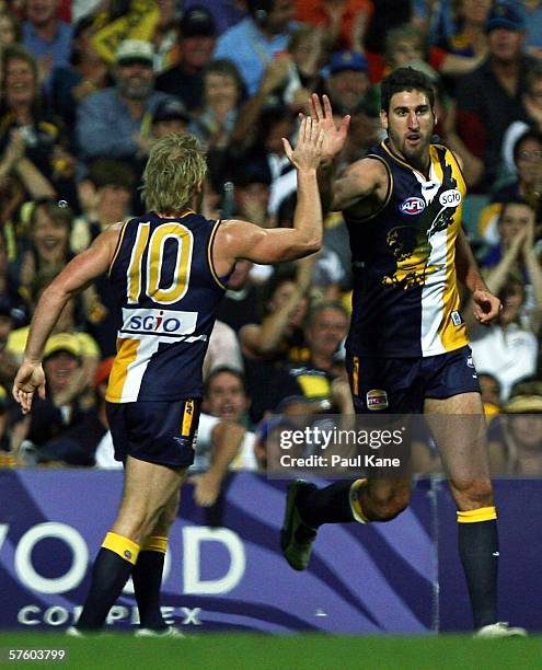 Michael Braun and Dean Cox of the Eagles celebrate a goal during the round seven AFL match between the West Coast Eagles and the Collingwood Magpies...