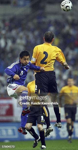 David Weir of Scotland and Mitsuo Ogasawara of Japan in action during the Kirin Cup Soccer 2006 between Scotland and Japan at the Saitama stadium on...