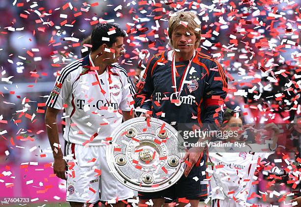 Oliver Kahn and Roy Makaay of Bayern celebrate with the trophy for the German Champion after the Bundesliga match between FC Bayern Munich and...
