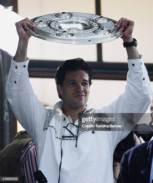 Michael Ballack celebrates with the trophy during the Bayern Munich champions party at the Marien Place on May 13, 2006 in Munich, Germany.