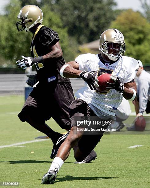 Rookie running back Reggie Bush of the New Orleans Saints practices during Rookie Camp on May 13, 2006 at the Saints Training Facility in Metairie,...