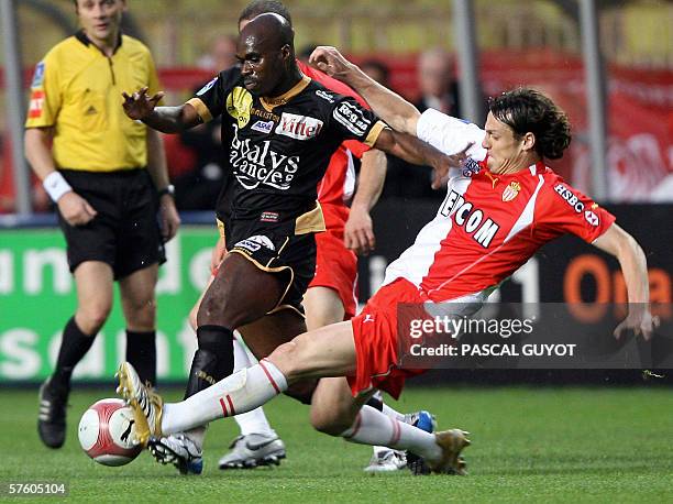 Monaco's defender Sebastien Squillaci is challenged by Nancy's forward Eli Kroupi during their French L1 football match Monaco vs Nancy, 13 May 2006,...