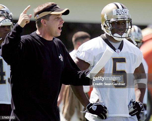 Rookie running back Reggie Bush of the New Orleans Saints stands along side Head Coach Sean Payton Rookie Camp on May 13, 2006 at the Saints Training...