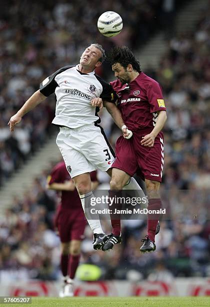 David Nicholls of Gretna jumps with Paul Hartley of Hearts during the Tennents Scottish Cup Final between Heart of Midlothian and Gretna at Hampden...