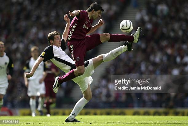 Takis Fyssas of Hearts battles with Kenny Deuchar of Gretna during the Tennents Scottish Cup Final between Heart of Midlothian and Gretna at Hampden...