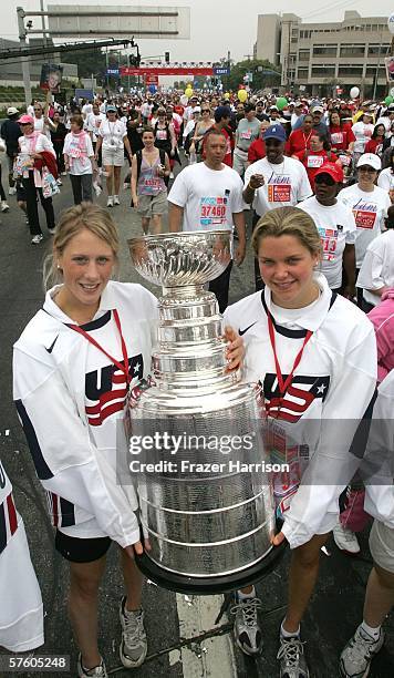 Members of the 2006 Olympic Women's Ice Hockey Team Helen Resor, and Sarah Parsons, carry the NHL Stanley Cup at the 13th Annual Revlon Run/Walk For...