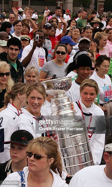 Members of the 2006 Olympic Women's Ice Hockey Team Helen Resor, and Sarah Parsons, carry the NHL Stanley Cup at the 13th Annual Revlon Run/Walk For...