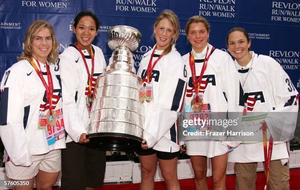 Members of the 2006 Olympic Women's Ice Hockey Team Jenny Potter, Julie Chu, Helen Resor, Sarah Parsons, and Chanda Gunn, pose with the NHL Stanley...