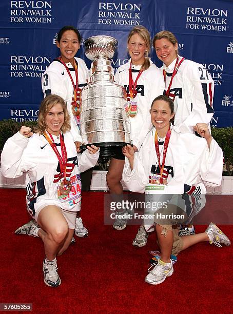 Members of the 2006 Olympic Women's Ice Hockey Team Jenny Potter, Julie Chu, Helen Resor, Sarah Parsons, and Chanda Gunn, pose with the NHL Stanley...