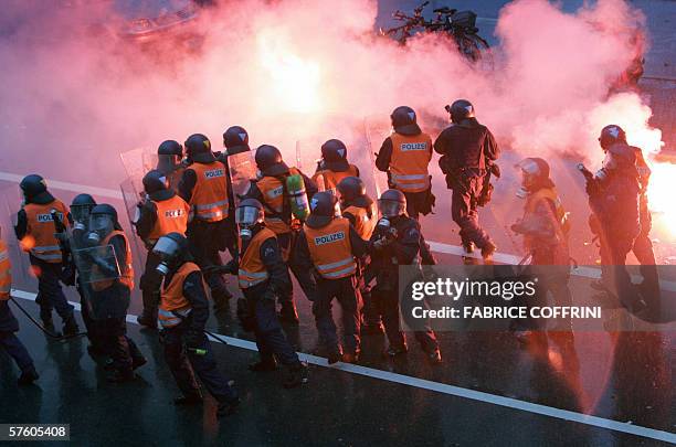 Swiss riot police take position around the FC Basel stadium after clashes at the end of a game FC Basel against FC Zurich during the last day of the...